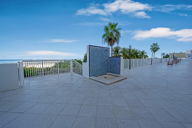 view of patio featuring a water view