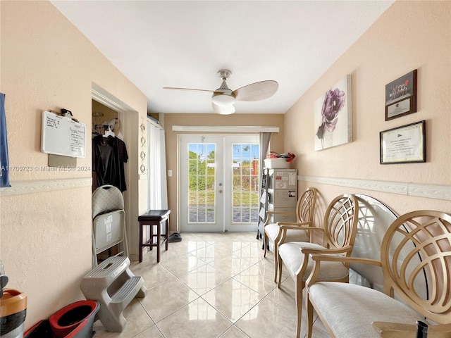 living area featuring ceiling fan, french doors, and light tile patterned flooring