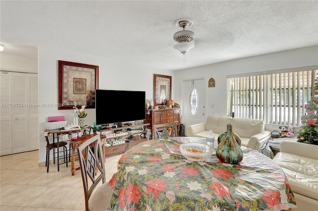 living room with light tile patterned floors and a textured ceiling