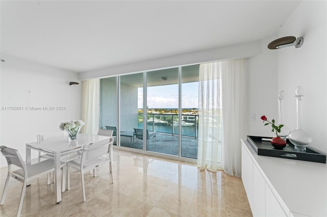 dining room featuring a water view