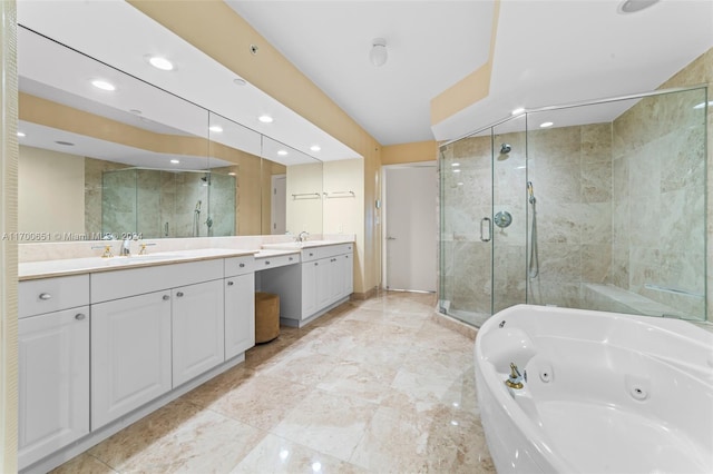 bathroom featuring vanity and separate shower and tub