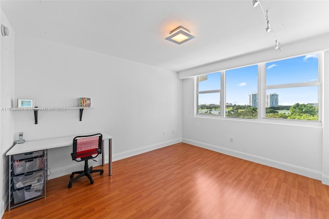 home office featuring hardwood / wood-style flooring