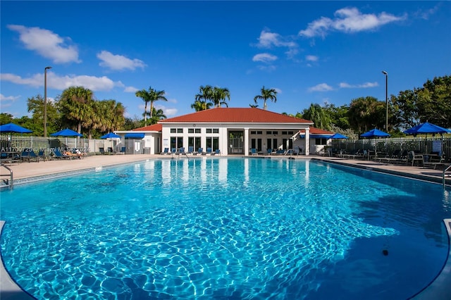 view of swimming pool with a patio