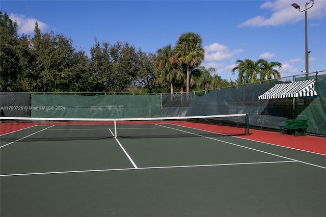 view of tennis court featuring basketball court