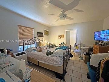 bedroom featuring ceiling fan and light tile patterned floors