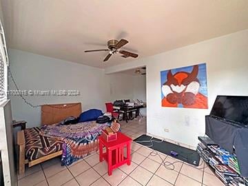 tiled bedroom with ceiling fan