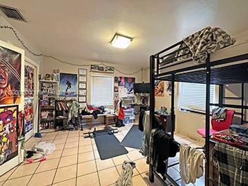 exercise room with tile patterned flooring