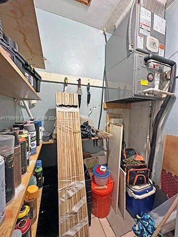 storage room featuring heating unit