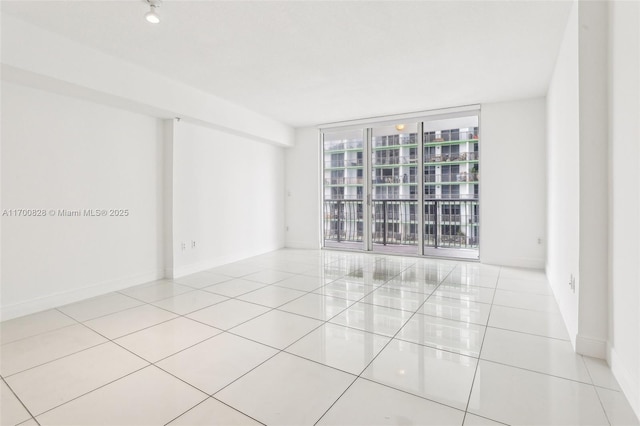 tiled empty room with expansive windows