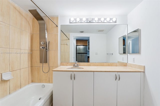 bathroom featuring shower / bathing tub combination and vanity