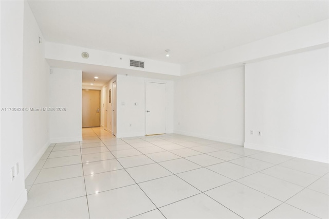 empty room featuring light tile patterned floors