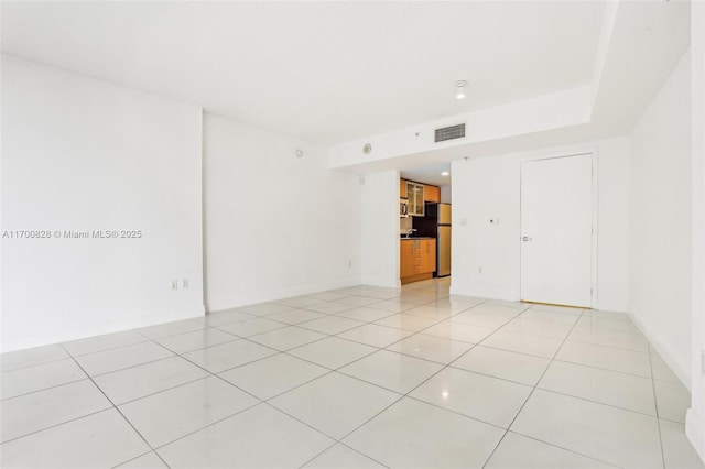 empty room featuring light tile patterned floors