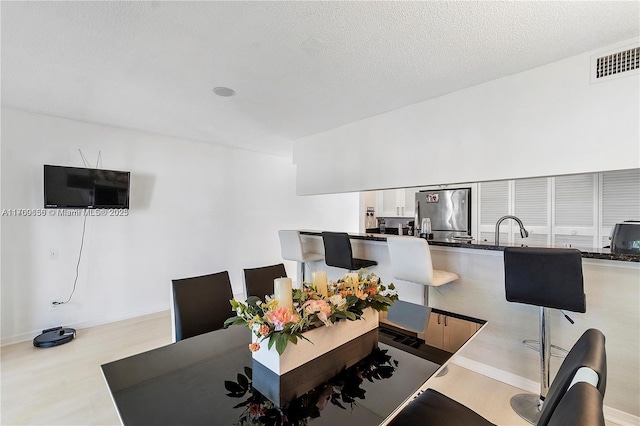 5236 NE 6th Ave Unit G25, Oakland Park, FL 33334 - home office featuring a sink, wood finished floors, and baseboards