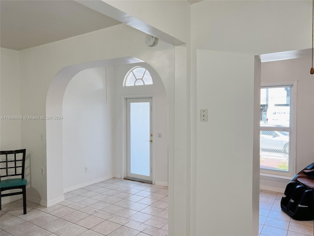 entryway with light tile patterned floors