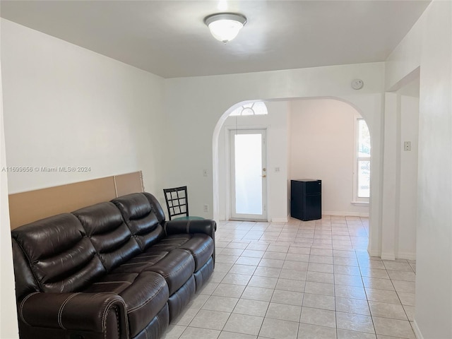 1428 SW 20th St, Miami, FL 33145 - living room featuring arched walkways and light tile patterned floors