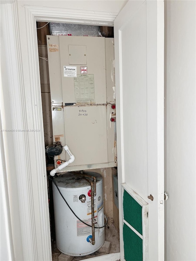1428 SW 20th St, Miami, FL 33145 - utility room featuring heating unit and water heater