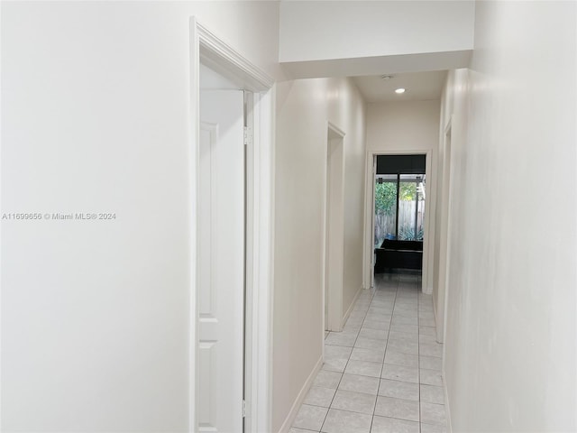 hallway with light tile patterned flooring