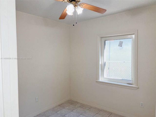1428 SW 20th St, Miami, FL 33145 - empty room with light tile patterned floors and a ceiling fan
