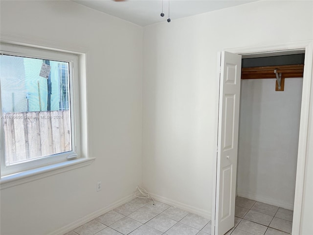 1428 SW 20th St, Miami, FL 33145 - unfurnished bedroom with light tile patterned floors and a closet