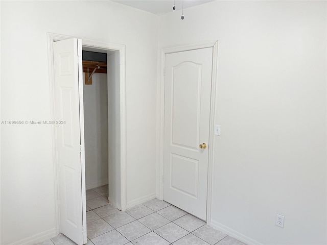 1428 SW 20th St, Miami, FL 33145 - unfurnished bedroom featuring light tile patterned floors and a closet