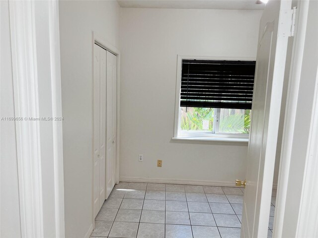 1428 SW 20th St, Miami, FL 33145 - unfurnished bedroom featuring light tile patterned floors and a closet