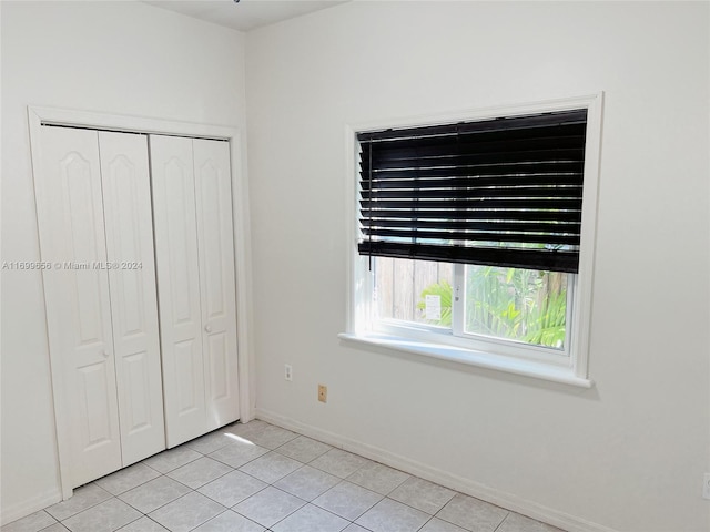 1428 SW 20th St, Miami, FL 33145 - unfurnished bedroom featuring light tile patterned floors and a closet