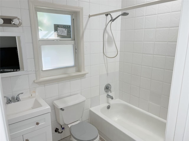 full bathroom featuring tasteful backsplash, toilet, vanity, tile walls, and tiled shower / bath