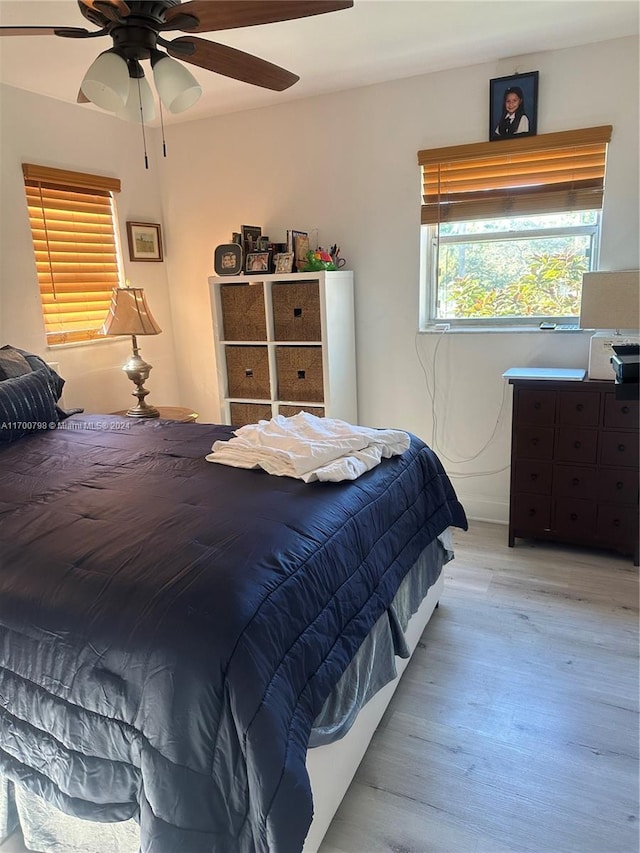 bedroom featuring ceiling fan and light hardwood / wood-style flooring