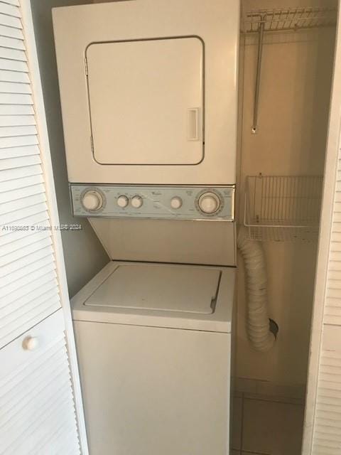 540 Brickell Key Dr Unit 830, Miami, FL 33131 - laundry area featuring stacked washing machine and dryer