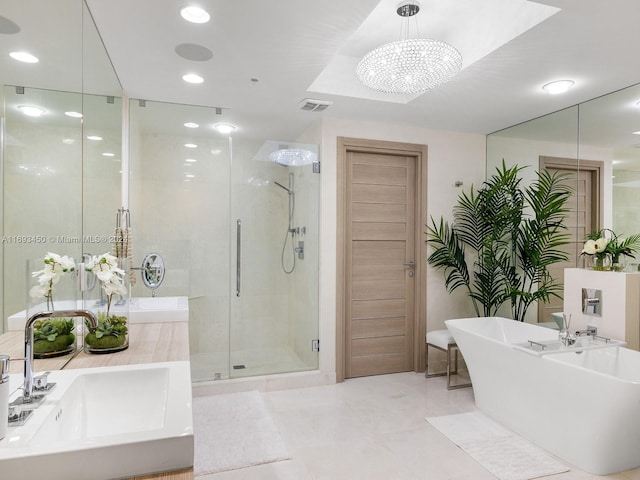 bathroom with sink, plus walk in shower, and a chandelier