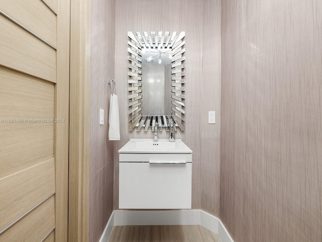 bathroom with hardwood / wood-style flooring and vanity