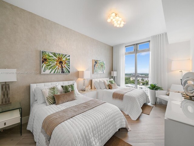 bedroom with hardwood / wood-style floors