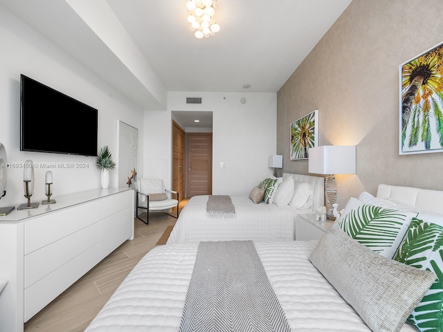 bedroom featuring light parquet flooring