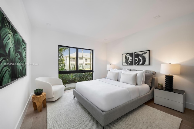 bedroom with wood-type flooring