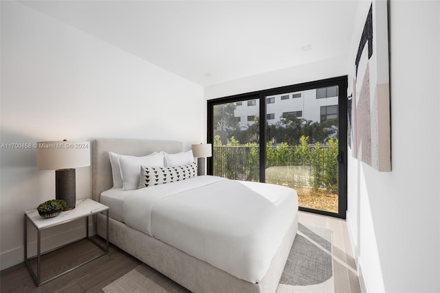 bedroom featuring hardwood / wood-style flooring and multiple windows