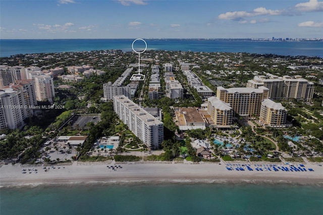 bird's eye view featuring a beach view and a water view