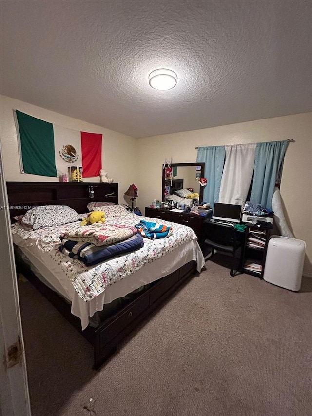 carpeted bedroom with a textured ceiling