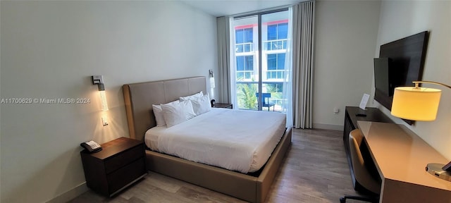 bedroom featuring wood-type flooring