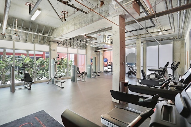 workout area with a high ceiling