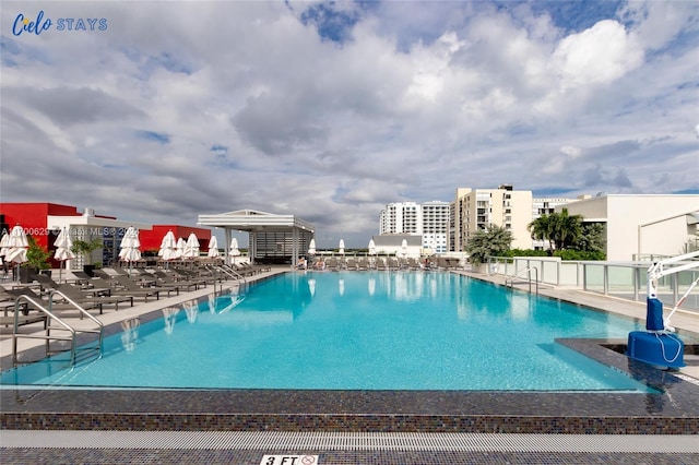 view of swimming pool with a patio area