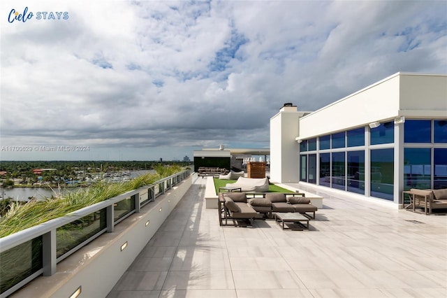 view of patio / terrace featuring an outdoor living space and a water view