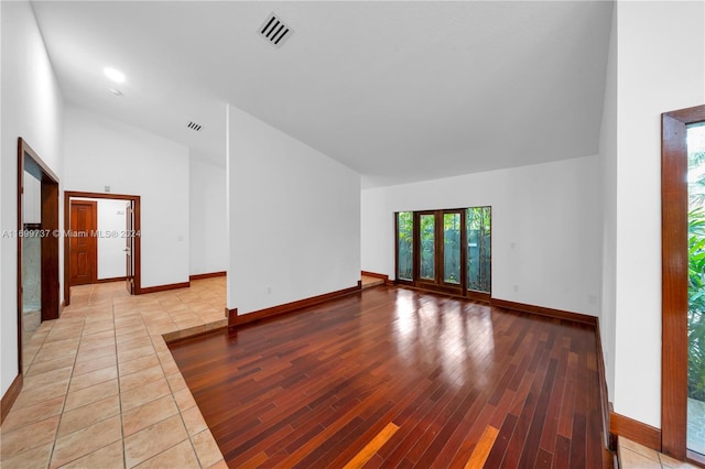 spare room with light hardwood / wood-style flooring