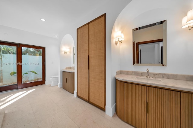 bathroom featuring vanity and toilet