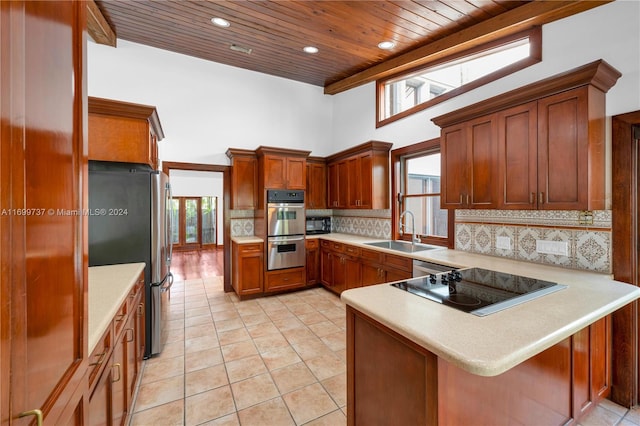 kitchen featuring kitchen peninsula, wooden ceiling, sink, and stainless steel appliances