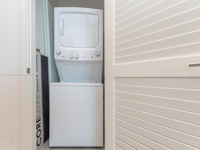 washroom with stacked washer / drying machine