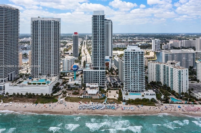 city view featuring a water view and a view of the beach