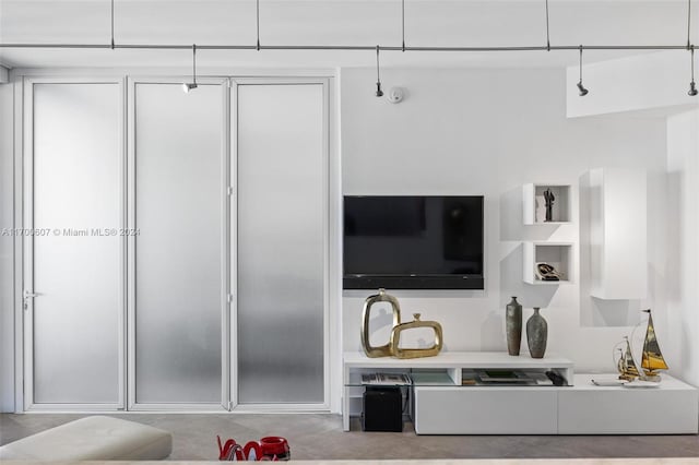 living room featuring concrete floors