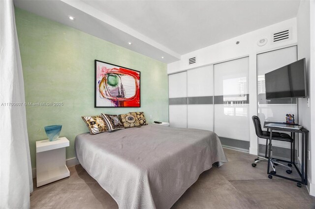 bedroom featuring expansive windows and light carpet