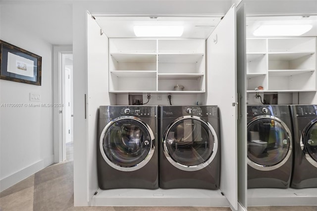 clothes washing area featuring washing machine and dryer