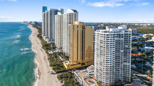 aerial view featuring a beach view and a water view